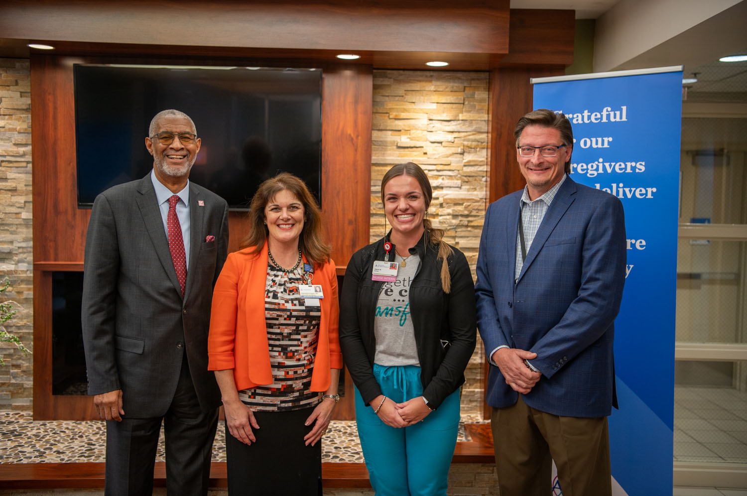 Two women flanked by two men